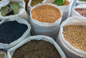 Variety of legumes in white bags