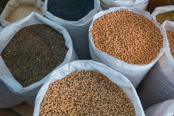 Variety of legumes in white bags