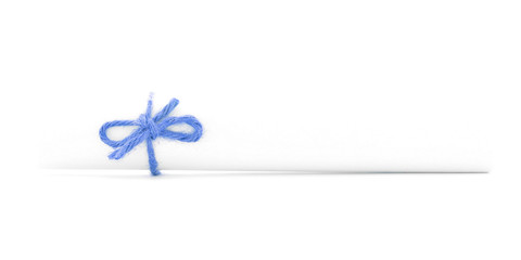 White paper tube tied with string, left blue bow isolated