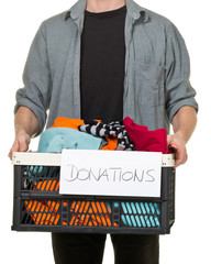 Man holding box with clothing donations
