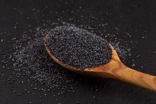 Wooden spoon with poppy seeds