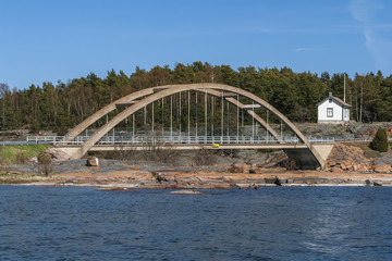 Fototapeta na wymiar Arch bridge across the strait