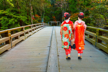 Japanese Geisha on a bridge to Ise Grand Shrine (inner shrine)