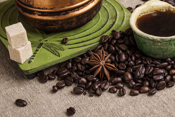 The copper cezve with coffee on the