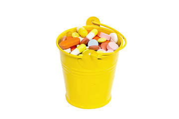 Fototapeta na wymiar pills in a small bucket