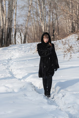 Girl in a black fur coat