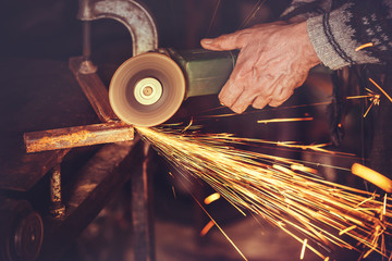 master of welding seams angle grinder - obrazy, fototapety, plakaty