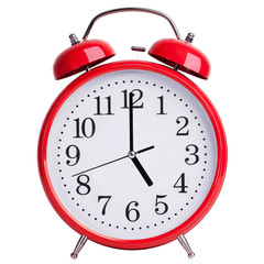 Alarm clock shows exactly five o'clock