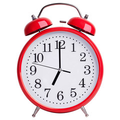 Alarm clock shows exactly seven o'clock