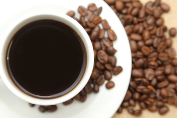 cup of coffee with roasted coffee