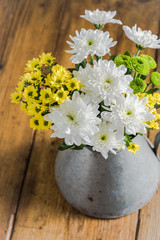 Fresh wild flowers in zinc vase
