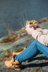 club sandwich in the hand of woman