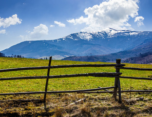 Fototapeta na wymiar rural area with snowy mountain tops