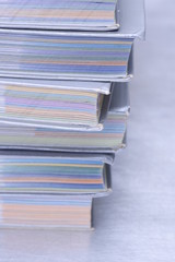 Pile of books on grey background with copy space for text