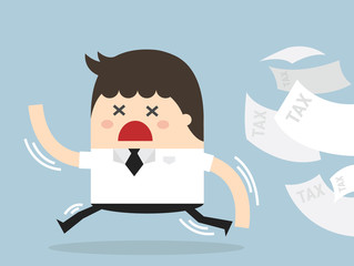 Businessman running away from tax