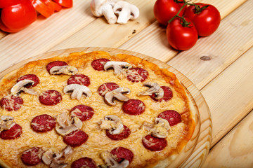 Delicious italian pizzas served on wooden table
