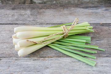 Fresh lemongrass (citronella) on wooden background - Spice for h