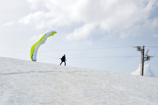 Winter kite skiing on the snowy slopes of Rila Mountains