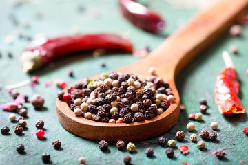 mix of various peppers in a spoon