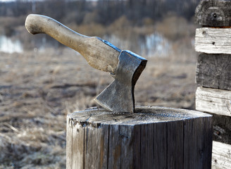 Axe in a log