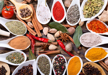 Fototapeta na wymiar various spices on wooden table