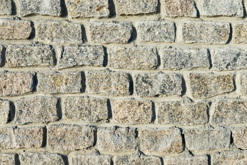 stones wall. granite bricks as background