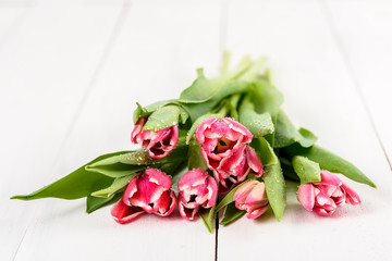 Flowers Bouquet Of Spring Wet Tulips On Wood Table