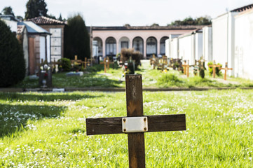 Cross with copyspace in a graveyard field