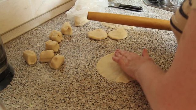 Cook rolls wooden rolling pin dough for pies 