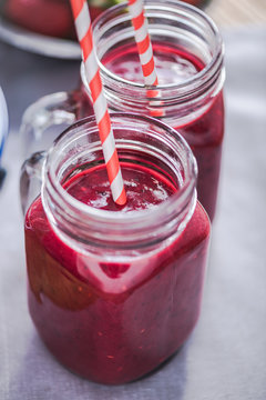 Dieting and well being concept, berry smoothie in jar