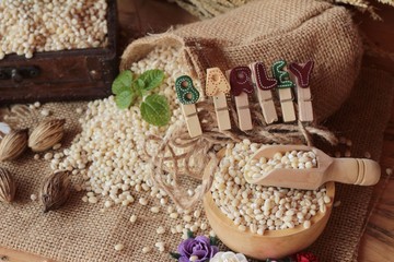 raw the barley on wood background.