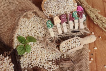 raw the barley on wood background.