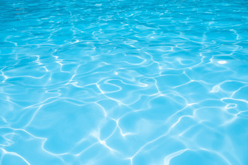 Naklejka na ściany i meble Water surface in swimming pool