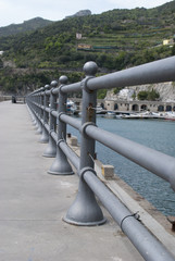 Pedestrian pier with benches and iron classic fences