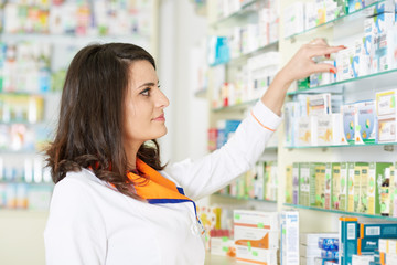 Pharmacist woman picking medicine