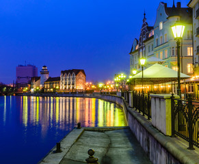 Ethnographic and trade center, embankment of the Fishing Village, night view, Kaliningrad, Russia.