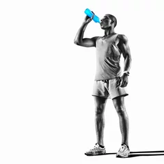 Gordijnen Young muscular build man silhouette drinking water of bottle after running, attractive athlete resting after workout outdoors, fitness and healthy lifestyle concept. Isolated on white   © vitaliy_melnik