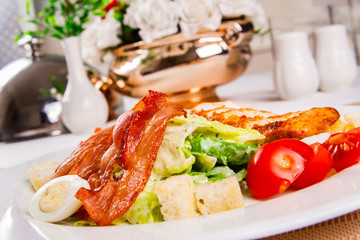 Caesar salad with chicken and bacon