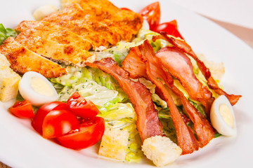 Caesar salad with chicken and bacon