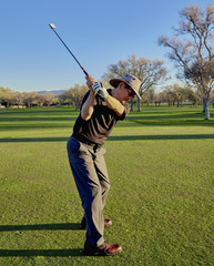 Senior Golfer practicing Golf Swing