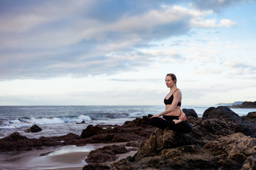 Naklejka na ściany i meble Sunrise yoga session on beach