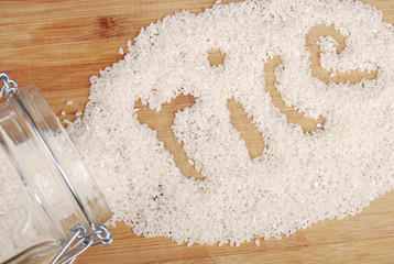 Background of rice on a wooden board