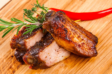 Pork ribs on wooden board
