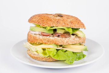 Sandwich with cheese, avocado, sirloin and lettuce