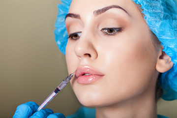 Beauty woman giving medical injections. Cosmetology. Beauty Face