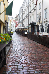Naklejka na ściany i meble Streets of the Old City in the rain. Tallinn, Estonia...