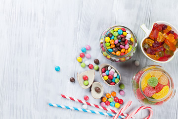 Fototapeta na wymiar Colorful candies on wooden table