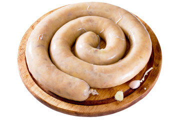 Homemade potato with bacon raw sausage on a wooden board