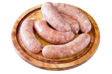 Homemade meat raw sausage on a wooden board