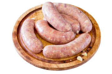 Homemade meat raw sausage on a wooden board
